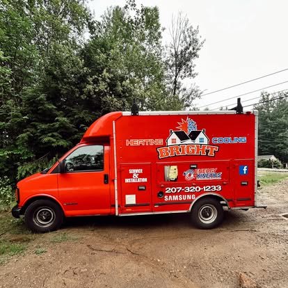 The bright red Bright Heating and Cooling service van, lettered with the logo and phone number (207) 320-1233