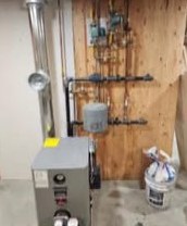 A new oil furnace installed by Bright Heating and Cooling with neat venting and piping